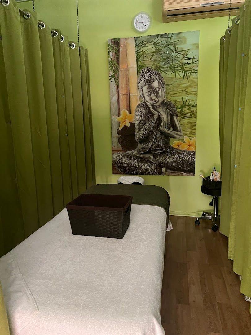 Treatment room with green curtains and peaceful decor